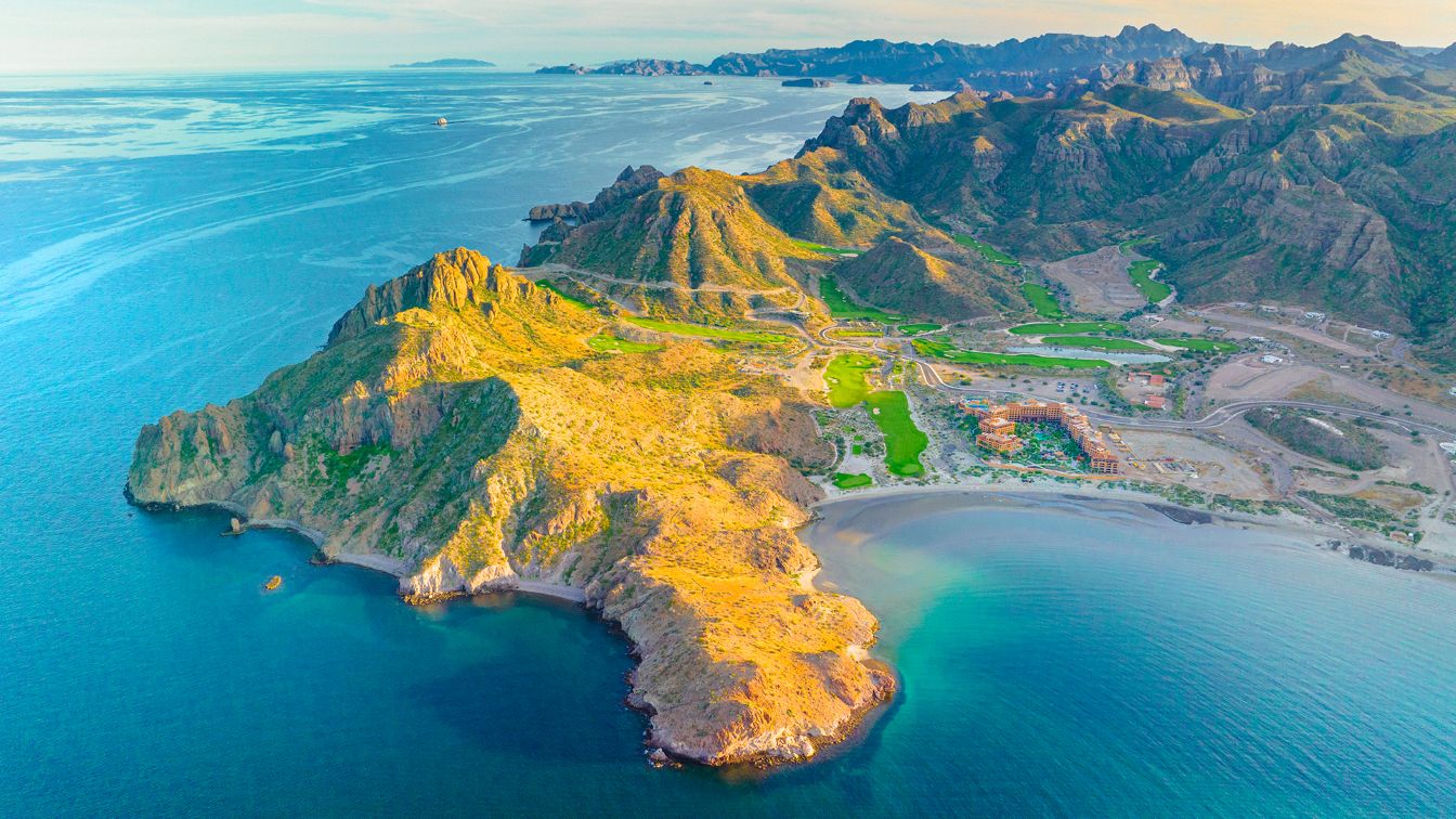 view from the sky looking down on Baja California and Loreto Mexico. ocean waters surrond three sides of the area