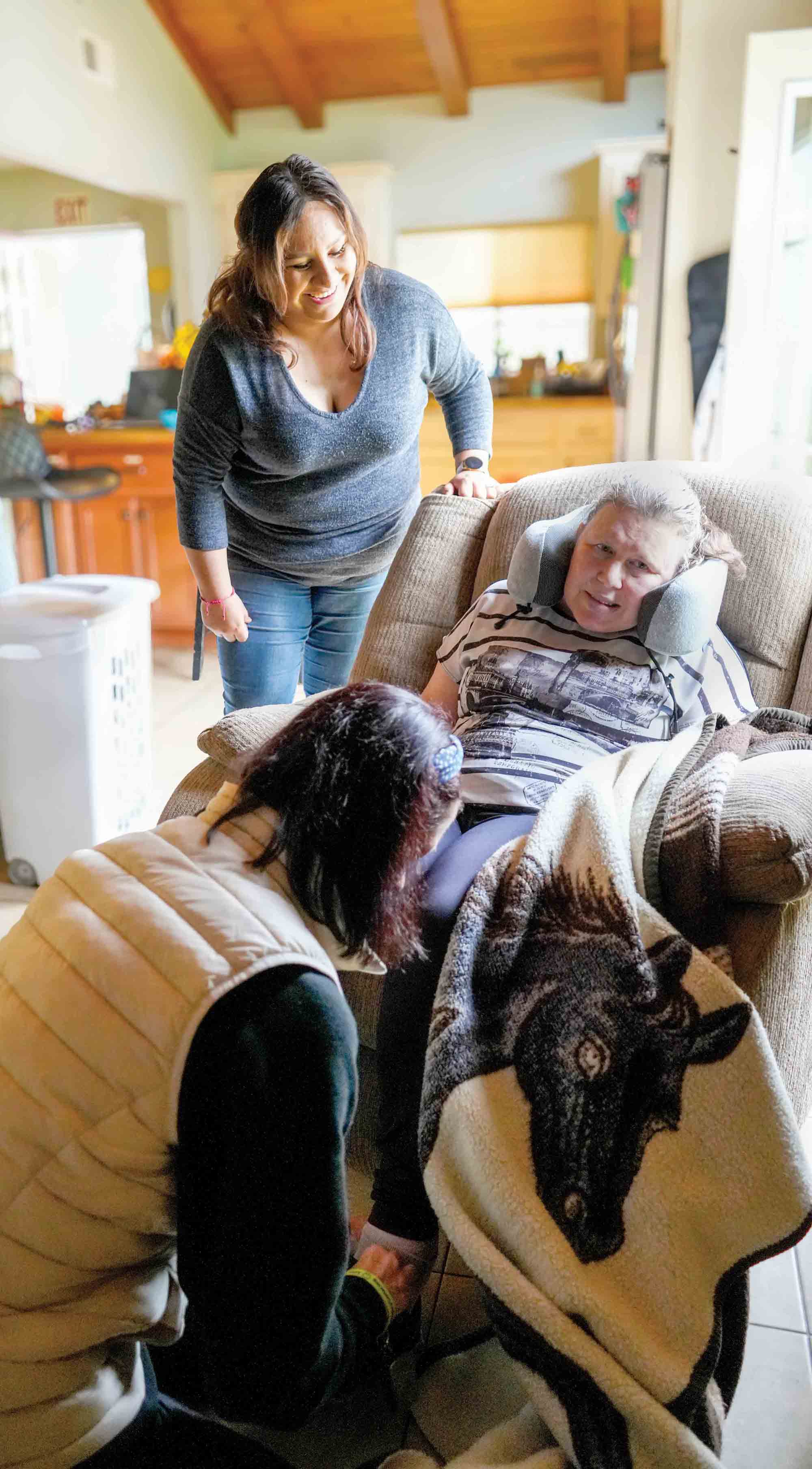 Members of the Brain Injury Center team assist a patient.